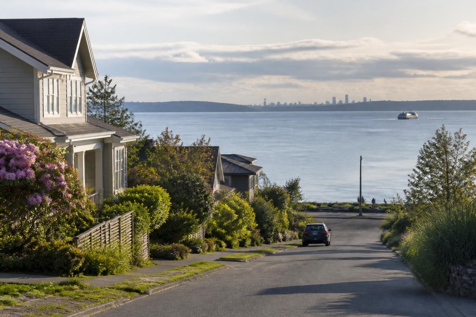 A quiet Alki waterfront neighborhood with soft ocean light.